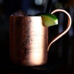 copper colored mug on table